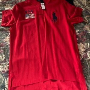 Red polo with the American flag attached to it